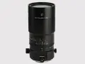 Czarny obiektyw makro 100mm f/2.8 z oznaczeniami odległości i przysłony.